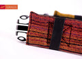 Girasol WrapMySol Twilight buckle hip belt side view — deep red-orange diamond handwoven cotton half buckle Mei Tai