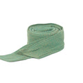 Girasol WrapMySol Tie-on Hip Belt Lizard coiled flat lay — sage green diamond handwoven cotton half buckle Mei Tai Meh Dai