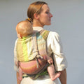 Girasol WrapMySol Rayos D'Oro back carry — warm gold pastel diamond weave half buckle carrier Mei Tai Meh Dai
