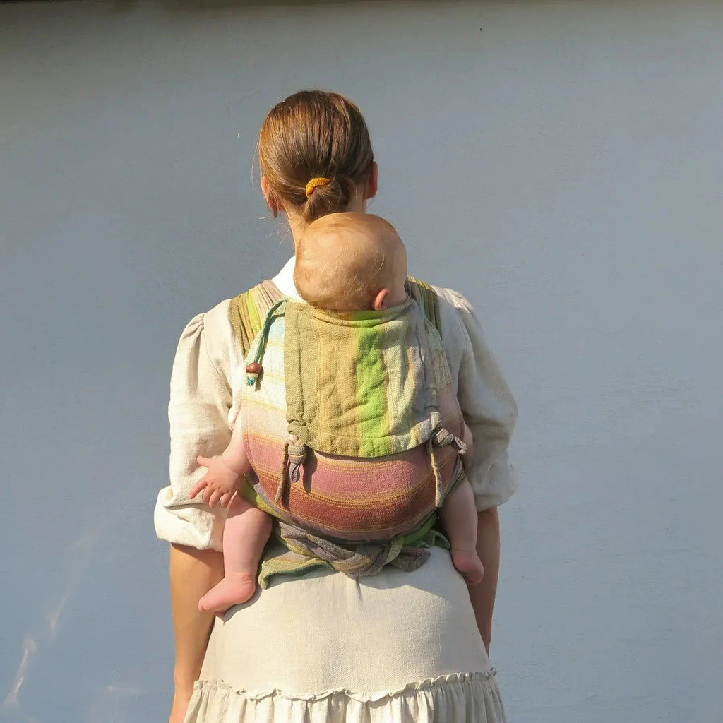 Girasol WrapMySol Rayos D'Oro back view worn — golden amber handwoven cotton half buckle Mei Tai Meh Dai newborn toddler

